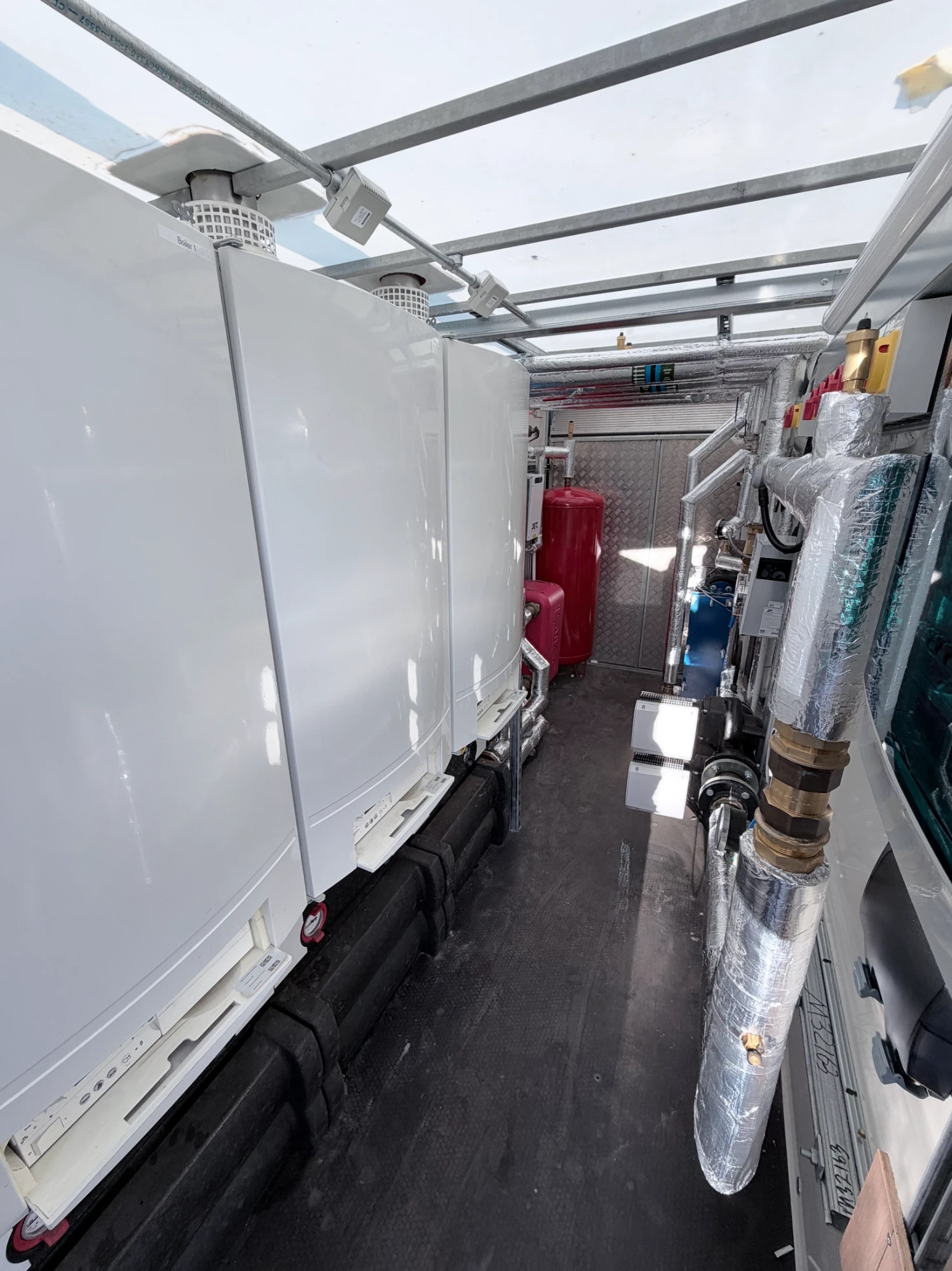 Row of commercial boilers inside a Stack trailer