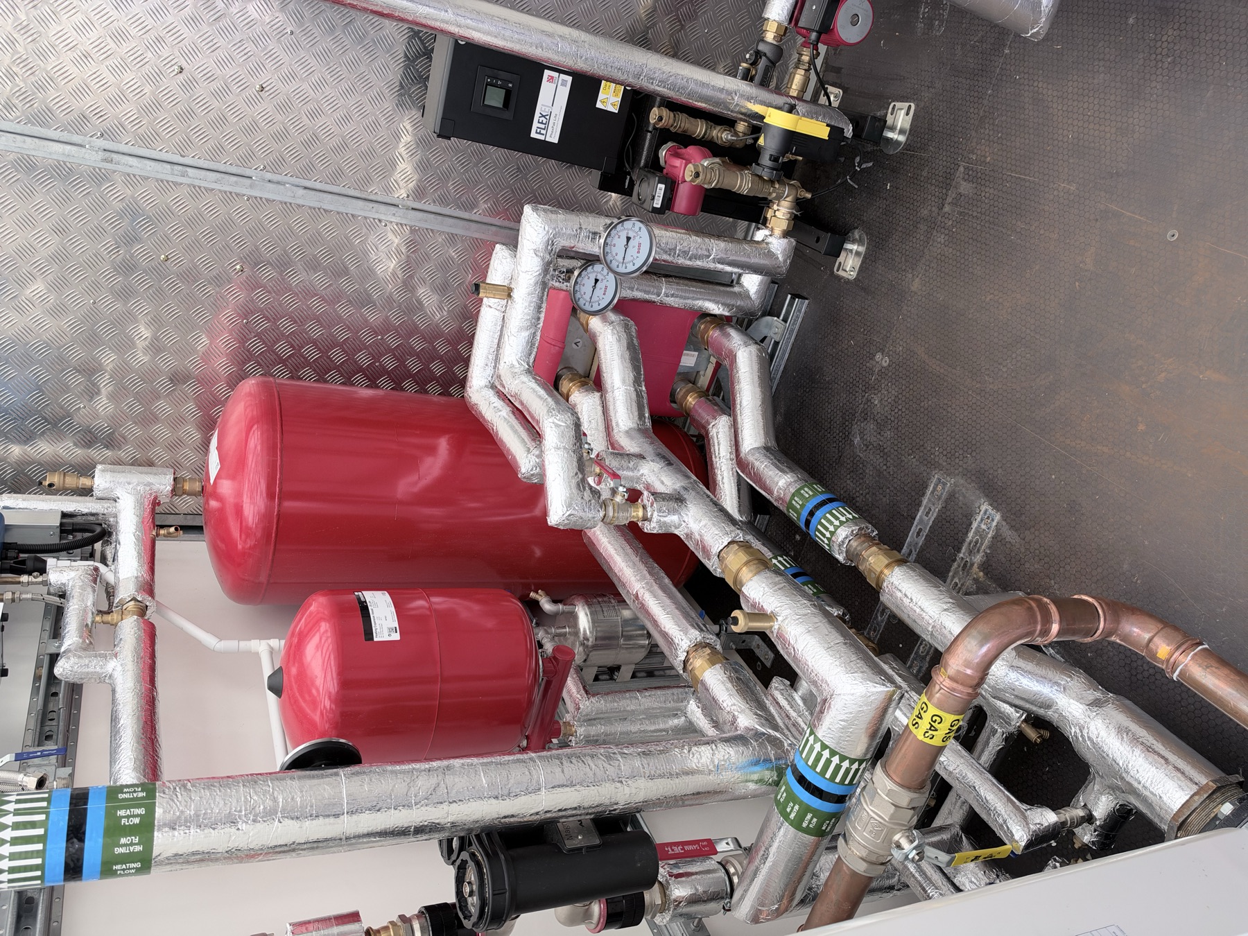 Expansion vessels and insulated pipework inside the trailer