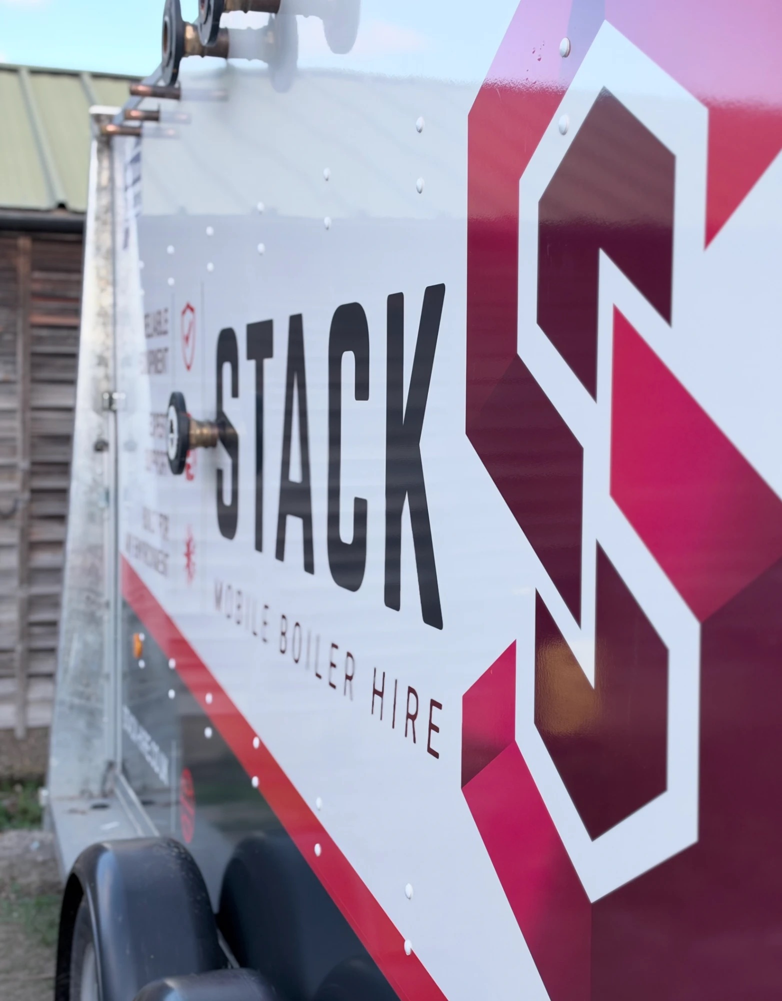 Close-up of the Stack logo on the side of a trailer