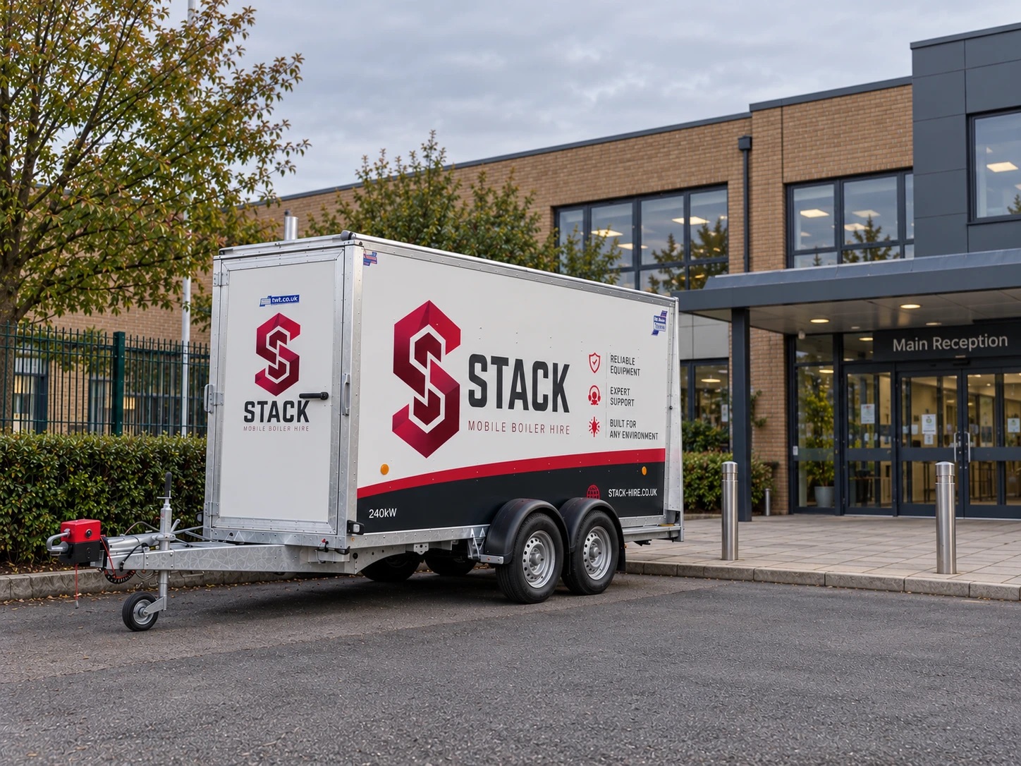 Stack trailer-mounted temporary boiler outside a school reception